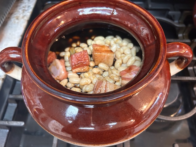 Bean pot filled with Boston Baked Beans